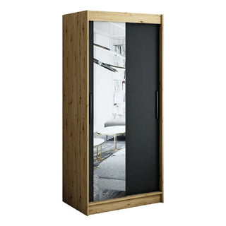 The CHOICEWARDROBE Laconia Mirrored Wardrobe features 2 sliding doors—one matte black, one mirrored—in a sleek black and oak finish, offering modern style and space-saving storage with smooth glide tracks against a white backdrop.