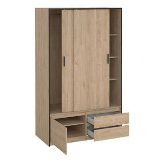 The CHOICEWARDROBE Lebanon Oak Sliding Door Wardrobe features two sliding doors, two drawers (one open, one closed), a bottom compartment with an open door, and three right-side open shelves in light brown with black edging.