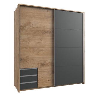 The CHOICEWARDROBE Limoni 2 Door Sliding Wardrobe, 180 cm, features an artisan oak and matt graphite finish with three horizontal drawers and a graphite panel—ideal for contemporary bedroom storage.