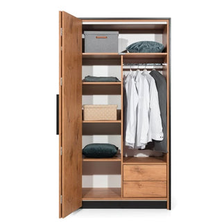 The CHOICEWARDROBE Logan Wooden Wardrobe – Left 1 Folding Door in Lancelot Oak & Black Frame opens to reveal shelves with boxes, folded clothes, drawers, and a rail holding several white shirts and one grey jacket.