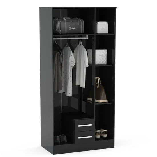 Interior view of a black high gloss wardrobe, showing a hanging rail with clothes, shelves, and two lower drawers.