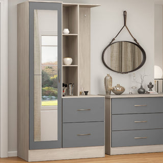 The CHOICEWARDROBE Mack 1 Door Mirrored Wardrobe with Drawers & Open Shelves in Grey & Oak Finish offers compact, stylish bedroom or entryway storage; its mirrored door reflects window views for a modern touch.