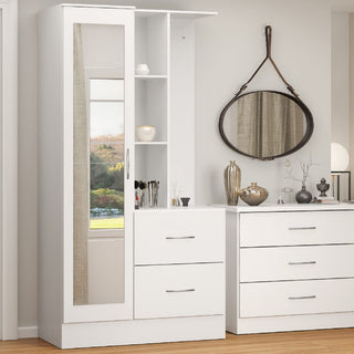 A modern bedroom features the CHOICEWARDROBE Mack 1 Door Mirrored Wardrobe with drawers and open shelves in a white finish, a space-saving storage unit, placed next to a matching dresser beneath a round mirror on a beige wall.