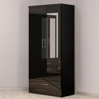 A black CHOICEWARDROBE Mack 2 Door Wardrobe with Mirror & 1 Drawer (74.5cm wide) stands against a light wall, its glossy finish reflecting part of the mirrored wardrobe and nearby drawers.