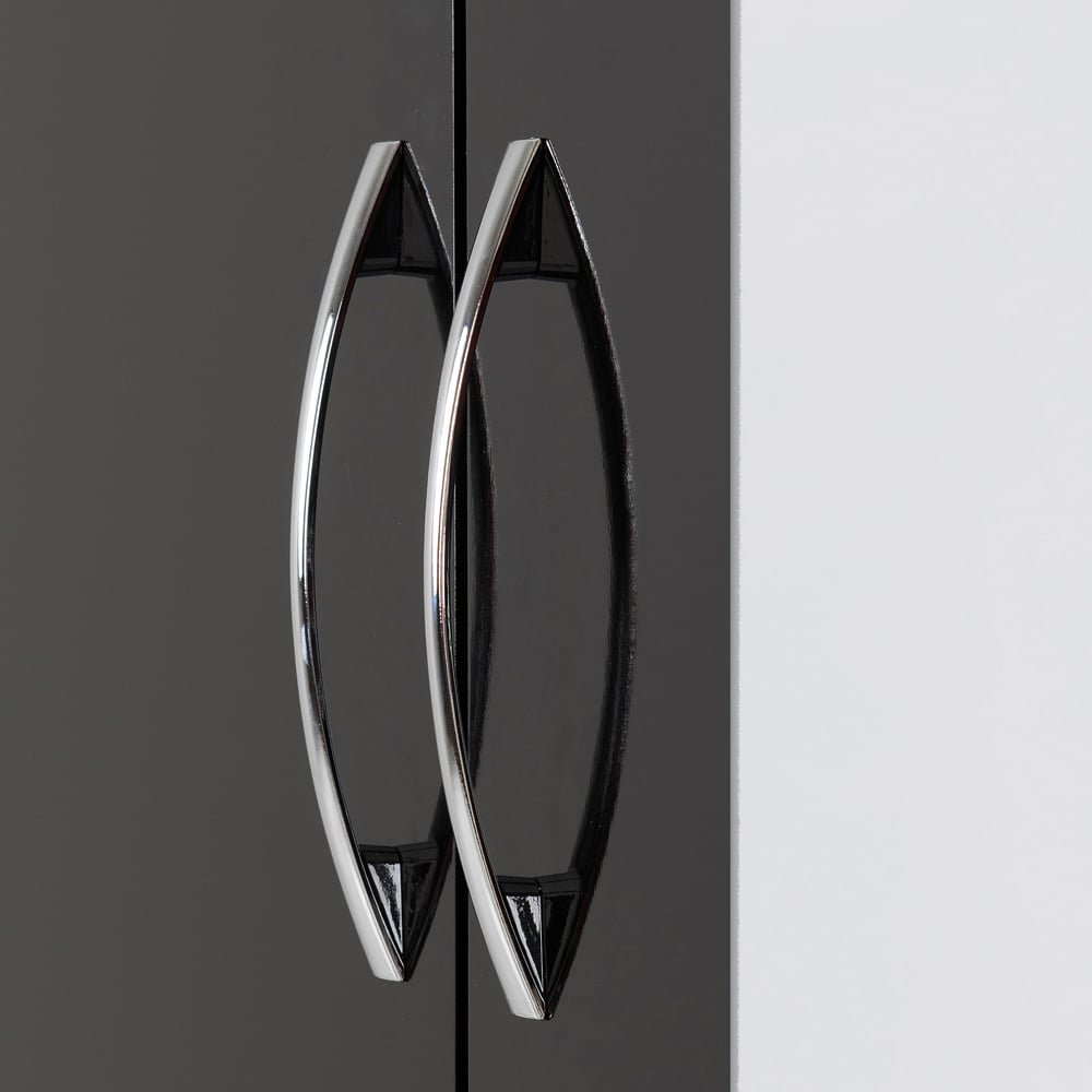 Close-up of chrome handles on a CHOICEWARDROBE Mack black gloss wardrobe, beside a white wall.