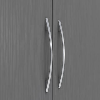 Close-up of the CHOICEWARDROBE Mack 2 Door Wooden Wardrobe’s curved silver handles on graphite grey doors with wood grain texture, featuring a modern design, hanging rail, and bottom drawer—perfect for stylish bedroom storage.