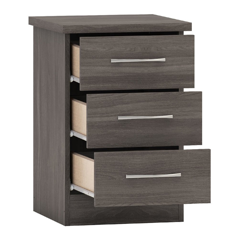 CHOICEWARDROBE Mack Grey Oak chest of drawers with three partially open drawers and silver handles.