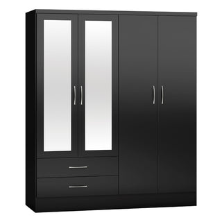 The CHOICEWARDROBE Mack 4 Door Black Gloss Bedroom Furniture Set includes a mirrored wardrobe, chest of drawers, and 2 bedside tables—ideal for a modern bedroom with its sleek design and ample storage.