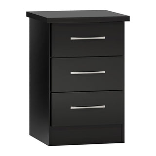 The CHOICEWARDROBE Mack 4 Door Black Gloss Bedroom Furniture Set features a modern mirror finish, including a wardrobe, chest of drawers, and 2 bedside tables—perfect for sleek, contemporary bedroom storage.