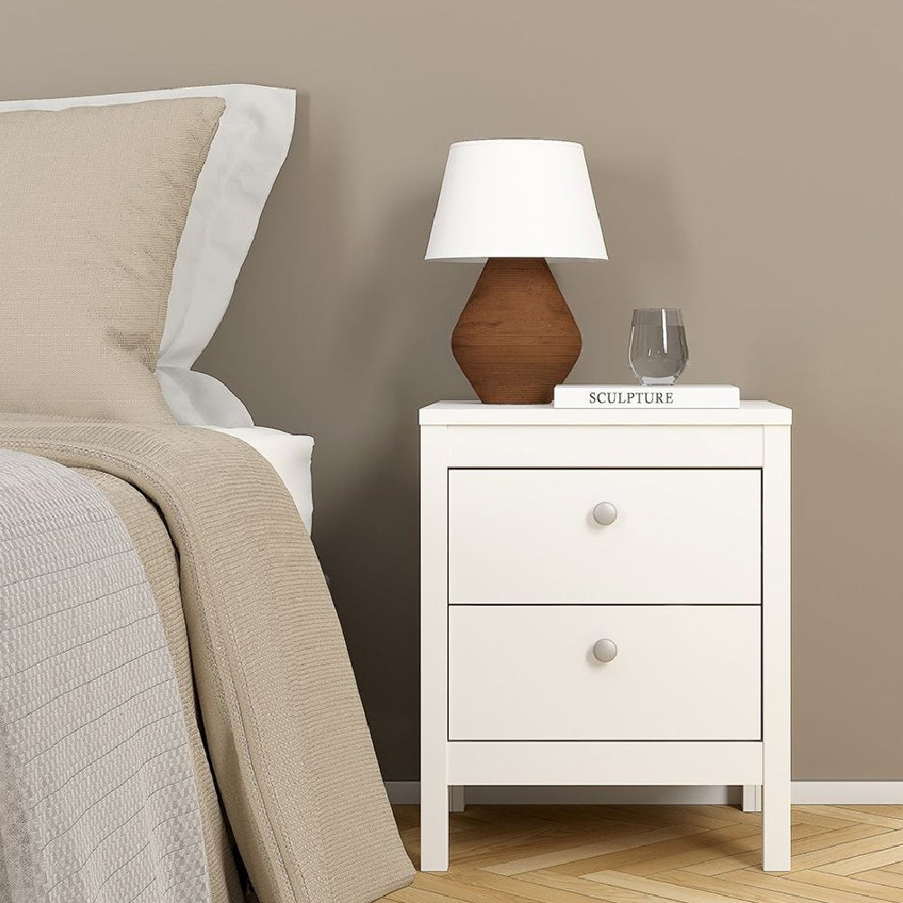 White bedside table from CHOICEWARDROBE Macron set next to bed, modern bedroom furniture.