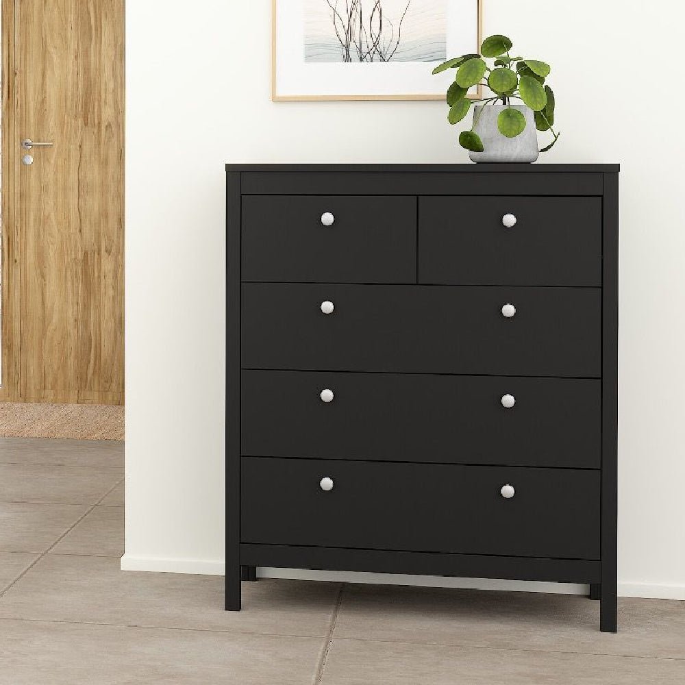 Black chest of drawers with white knobs, modern bedroom furniture with 5 drawers.