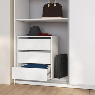 The CHOICEWARDROBE Madrid 220cm 3 Door Sliding Mirrored Wardrobe in high gloss white features shelves and hanging rails for storage, with minimalist design. Accessories and folded clothes are shown on the drawers and shelves.