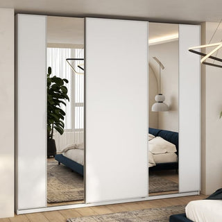 A modern bedroom showcases the CHOICEWARDROBE Madrid 250cm 3 Door Sliding Mirrored Wardrobe in high gloss white with full-length mirror doors, smooth glide tracks, and internal shelves—offering elegant, neutral-toned storage.