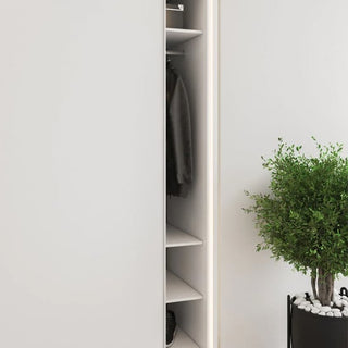 The CHOICEWARDROBE Madrid 250cm wardrobe features high gloss white finish, full-length mirrored sliding doors, smooth glide tracks, and internal shelves for stylish bedroom storage. Beside it sits a black pot with a green plant on white decorative stones.