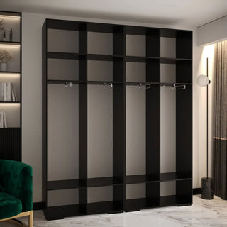 The CHOICEWARDROBE Madrid 4 Door Wooden Wardrobe (200cm wide) features a black fluted design with gold circular handles and premium sliding storage, offering luxurious bedroom organization beside a green chair and bookshelf on a marble floor.