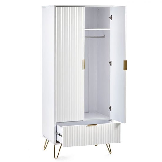 Matt white 2 door wardrobe with fluted detail, gold legs, and drawer.