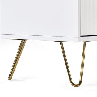 Close-up of the bottom corner of the CHOICEWARDROBE Marius Fluted 2 Door Wardrobe in matt white, featuring slim, angled brushed gold legs and drawer, set against a plain background.