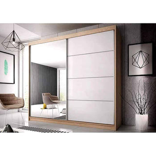 The CHOICEWARDROBE Mesa 2 Door Mirrored Sliding Wardrobe (183cm, Oak & White Finish) with smooth sliding doors and full-length mirror stands in a modern room with gray walls, minimal furniture, and geometric decor.
