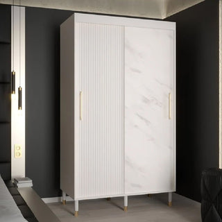The CHOICEWARDROBE Millwall 120cm Sliding Wardrobe features white ribbed and marble texture fronts, gold-tone handles, raised legs, and internal shelving—ideal for modern bedrooms and designer interiors.