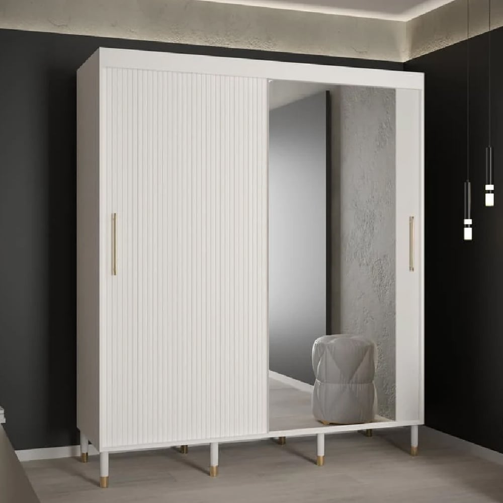 White sliding door wardrobe with ribbed panel, mirrored door, and gold handles.