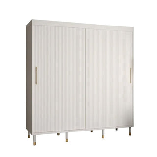The CHOICEWARDROBE Millwall 200cm White Sliding Door Wardrobe features a fluted panel design, gold handles, and elevated legs. Its modern, minimalistic wood build is perfect for stylish bedroom storage.