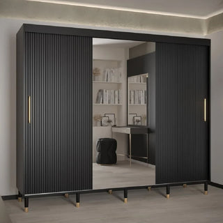 ChoiceWardrobe Millwall 3 door sliding mirrored wardrobe in black finish with gold handles, styled in a luxury bedroom.