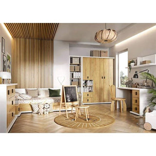 A modern children's room with the CHOICEWARDROBE Minot Kids 2 Door Wooden Wardrobe in oak & white, a bed, desk, shelves, round rug, wooden ceiling accents, soft toys, and neutral decor filled with natural light from a window.