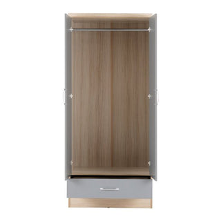 The CHOICEWARDROBE Modara Grey Gloss & Oak 2 Door 1 Drawer Wardrobe with Mirror features a sleek, modern design with light grey gloss doors, an empty interior with a hanging rod, and a bottom drawer—ideal for bedroom storage.