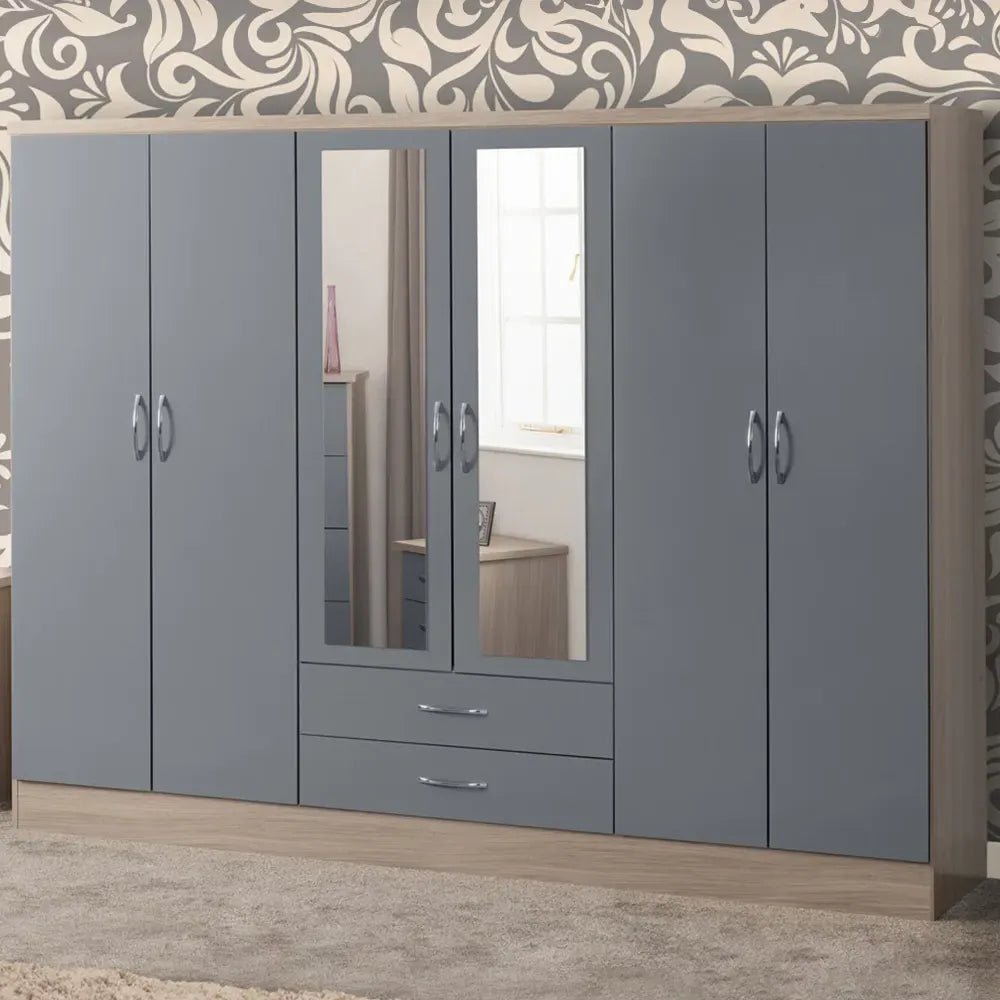 CHOICEWARDROBE 6 door grey high gloss wardrobe with central mirrored doors, oak trim, and silver handles. Two drawers below mirrors.