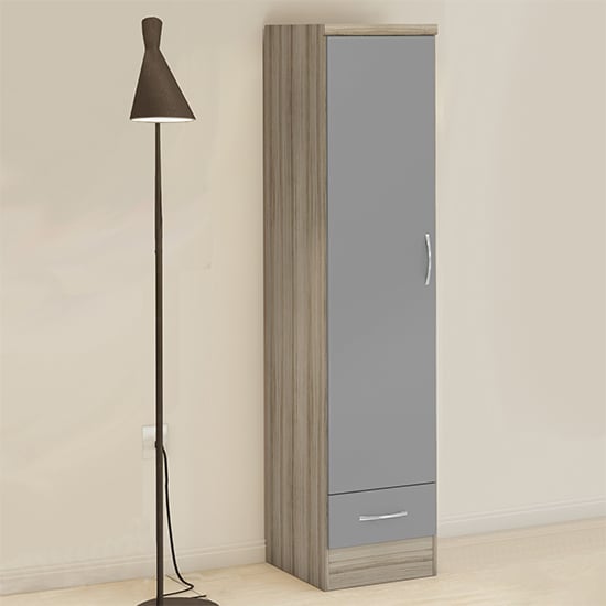CHOICEWARDROBE Modara slim 1-door wardrobe with drawer, grey gloss and light oak effect, next to floor lamp.