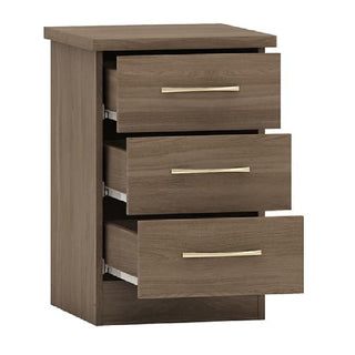 The CHOICEWARDROBE Modara Rustic Oak Bedroom Furniture Set includes a 3-door mirrored wardrobe, chest of drawers with horizontal metal handles, and bedside tables in a modern, medium brown oak finish—perfect for any bedroom.
