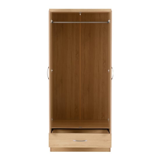 Sonoma oak wardrobe interior with hanging rail and one drawer visible.