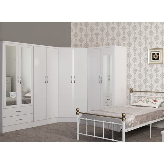 White gloss corner wardrobe with two doors and mirrored panels in a modern bedroom