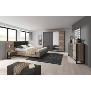 Modern bedroom featuring a platform bed, nightstands, black and wood dresser, and the CHOICEWARDROBE Nadir Grande Oak & Concrete 3 Door Sliding Mirrored Wardrobe. A geometric rug and large windows complement the neutral gray-toned decor.