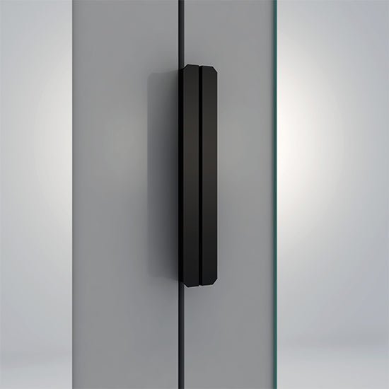 Black handle on a grey and white gloss wardrobe door with mirrored panel detail.