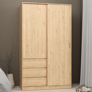 A CHOICEWARDROBE Nakou 2 Door Sliding Wardrobe with 3 drawers in Jackson Hickory Oak stands against a taupe wall near a bed and window with white curtains.