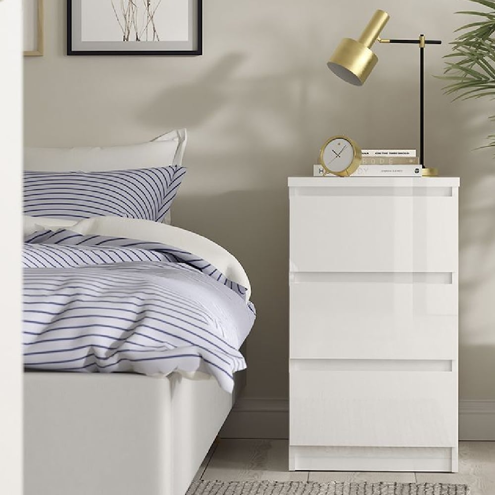 CHOICEWARDROBE Nakou 3 Piece White High Gloss Bedroom Furniture Set: Bedside table with gold lamp.