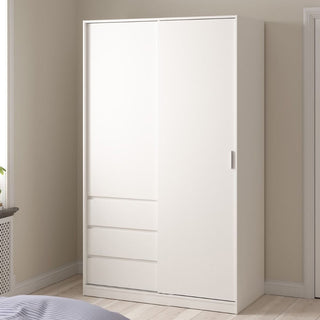 The CHOICEWARDROBE Nakou Sliding Door Wardrobe, featuring a white high gloss finish, 1 sliding door, and 4 drawers, stands against a beige wall in a bedroom with wooden floors, offering modern minimalist storage. A bed and window are visible in the scene.