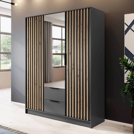 Graphite 3-door hinged wardrobe with mirrored door and oak slat detailing, two drawers visible.