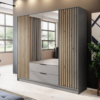 The CHOICEWARDROBE Norco 206cm 4 Door Mirrored Wardrobe in grey with oak slatted panels and central drawers complements bright rooms with large windows and light wood floors.