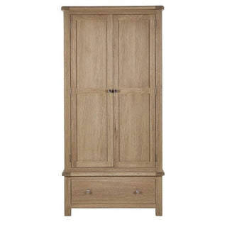 The CHOICEWARDROBE Norland Limed Oak 2 Door Wardrobe features paneled doors, a spacious bottom drawer, and metal handles. Its light natural finish adds timeless appeal to this classic wooden farmhouse-style wardrobe.