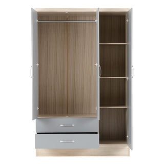 The CHOICEWARDROBE Nunky 3 Door Mirrored Wardrobe features a grey gloss front, oak frame, mirrored doors, and two drawers. The wardrobe measures 116cm wide and offers stylish storage for your bedroom.