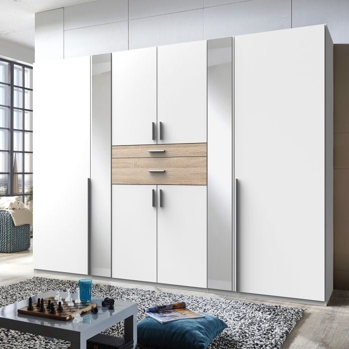 White 6 door wardrobe with oak effect drawers and mirrored panels.
