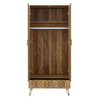 The CHOICEWARDROBE Orlana 2 Door Wardrobe in mango wood effect features a hanging rod, top shelf, geometric detailing, and brass legs—perfect modern bedroom storage with a stylish look.