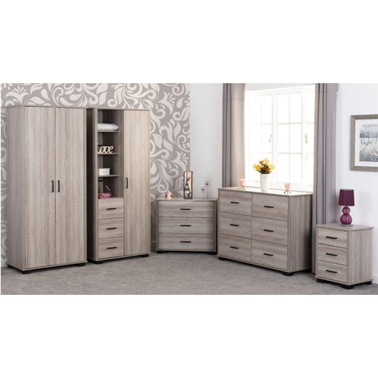 CHOICEWARDROBE Oxnard light oak 2 door wardrobe with bedside table, two chests of drawers, and a dresser.