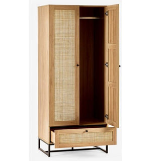 The CHOICEWARDROBE Pabla 2 Door 1 Drawer Wooden Wardrobe (80cm Oak Finish) features rattan-style fronts and a black metal frame base, with its doors and bottom drawer open to reveal a hanging rod and spacious interior.