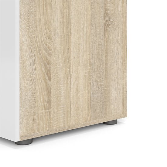 Oak effect side panel of a CHOICEWARDROBE Parker 2-door wardrobe, showing the base and small feet.