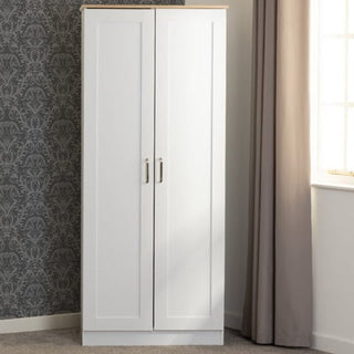 The CHOICEWARDROBE Parnu 2 Door Wooden Wardrobe in a White & Oak finish features silver handles and a compact 80cm design with hanging rail and shelf, perfect for bedroom storage in modern Scandinavian style.