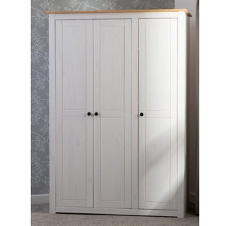 The CHOICEWARDROBE Pavia White & Natural Wax 3 Door Wardrobe offers spacious bedroom storage with a rustic country finish, featuring black round handles and a light wood top for a stylish look.
