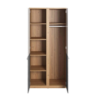 The CHOICEWARDROBE Peoria 2 Door Wardrobe in White & Concrete with Oak Frame is a modern storage cupboard, featuring shelves on the left and a hanging rod with open space on the right for stylish bedroom organization.
